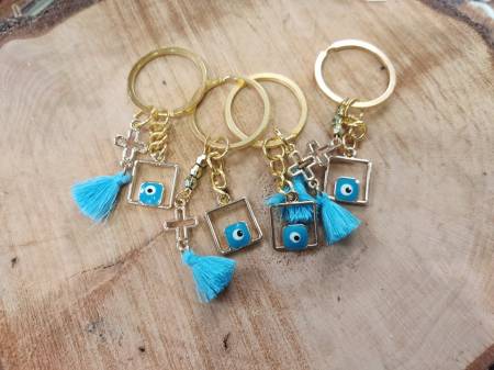 Certificate keychain with square eye, perforated cross and tassel K61